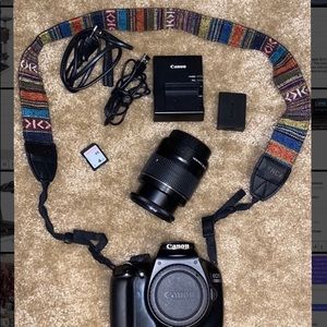 Canon EOS Rebel T3 (EOS 1100D) with 18-55mm lens
Charger, battery, 4GB SD card